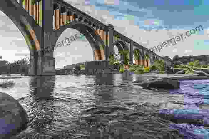 A Magnificent Railroad Bridge Spanning A Wide River, Its Arched Structure Mirroring The Strength Of The Railroad Itself. Chicago Central Railroad Images: Railroad Images Along The CC P